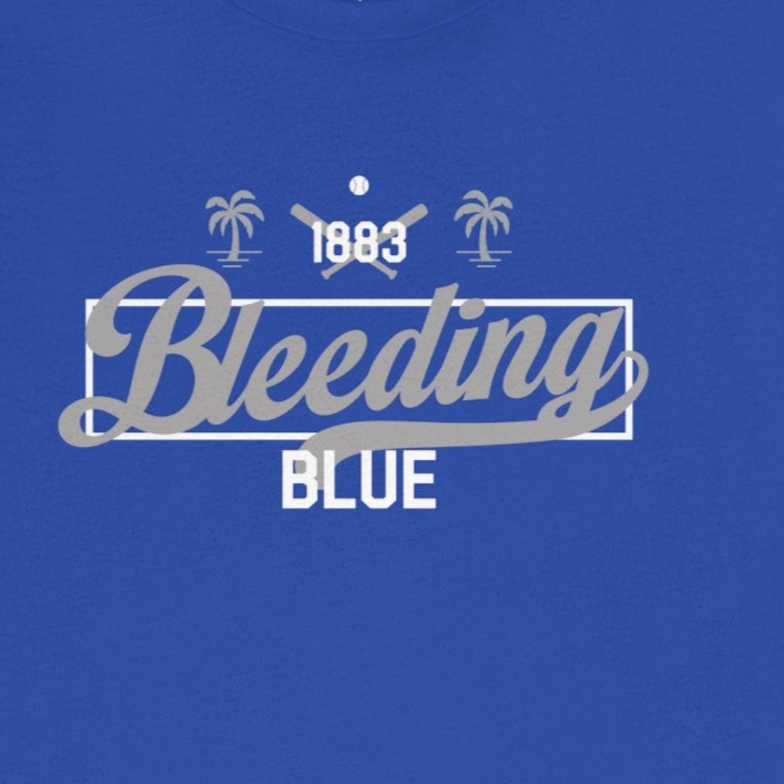 Blue t-shirt with '1983 Bleeding Blue' text on a white background