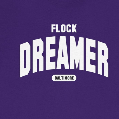 Purple t-shirt with 'Flock Dreamer Baltimore' text on a white background